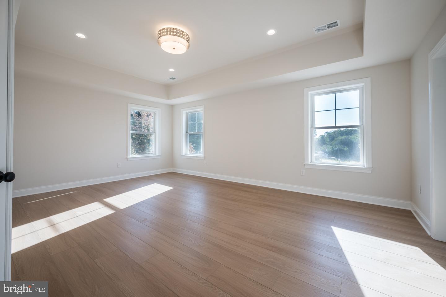 548 Old Forge Road, Unit 1 Media, PA 19063 - Photo 28 of 37 a view of an empty room with wooden floor and a window