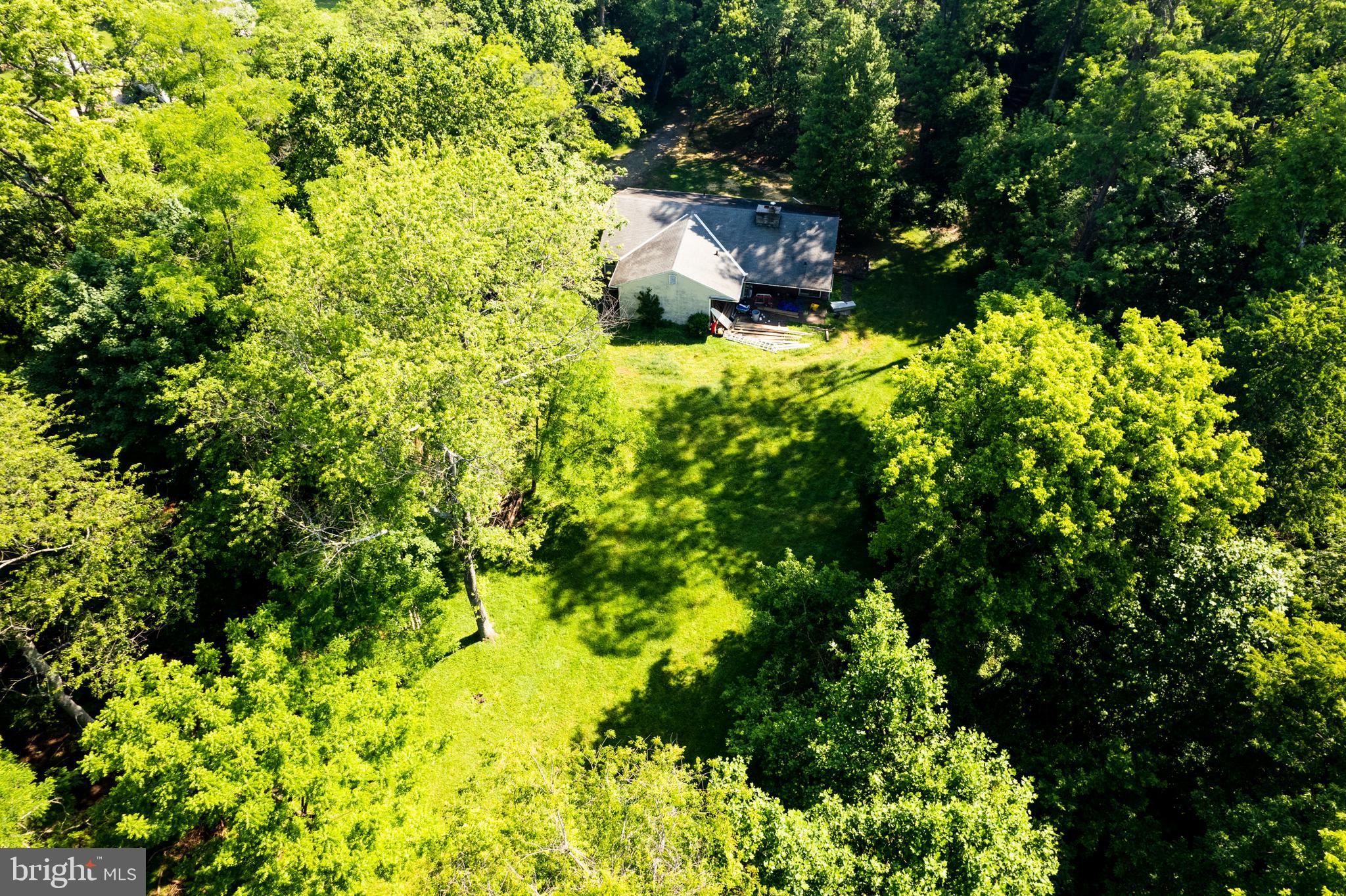548 Old Forge Road, Unit 1 Media, PA 19063 - Photo 33 of 37 a backyard of a house with a yard and outdoor seating