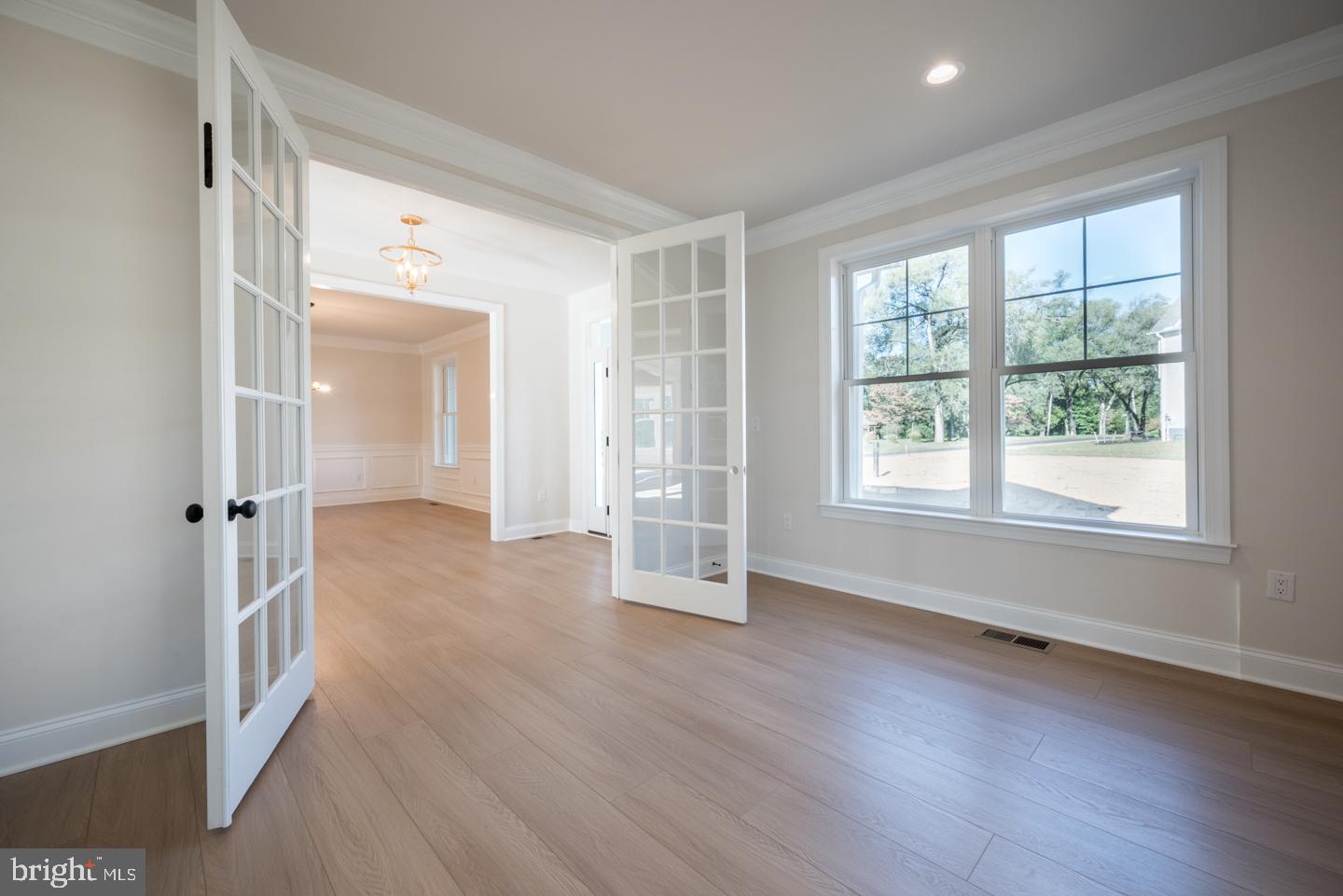 548 Old Forge Road, Unit 1 Media, PA 19063 - Photo 5 of 37 an empty room with wooden floor and windows