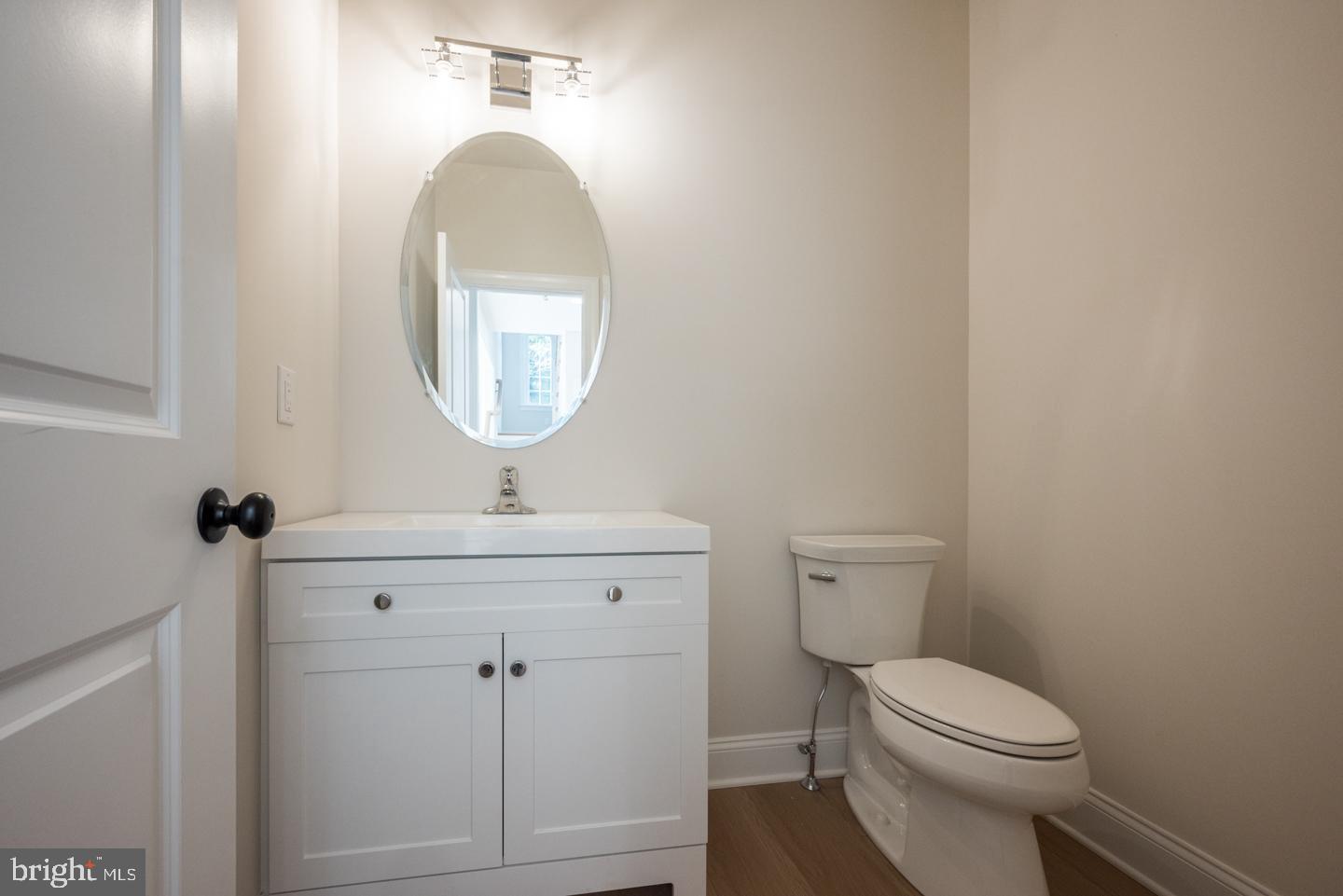 548 Old Forge Road, Unit 1 Media, PA 19063 - Photo 6 of 37 a bathroom with a toilet a sink and mirror