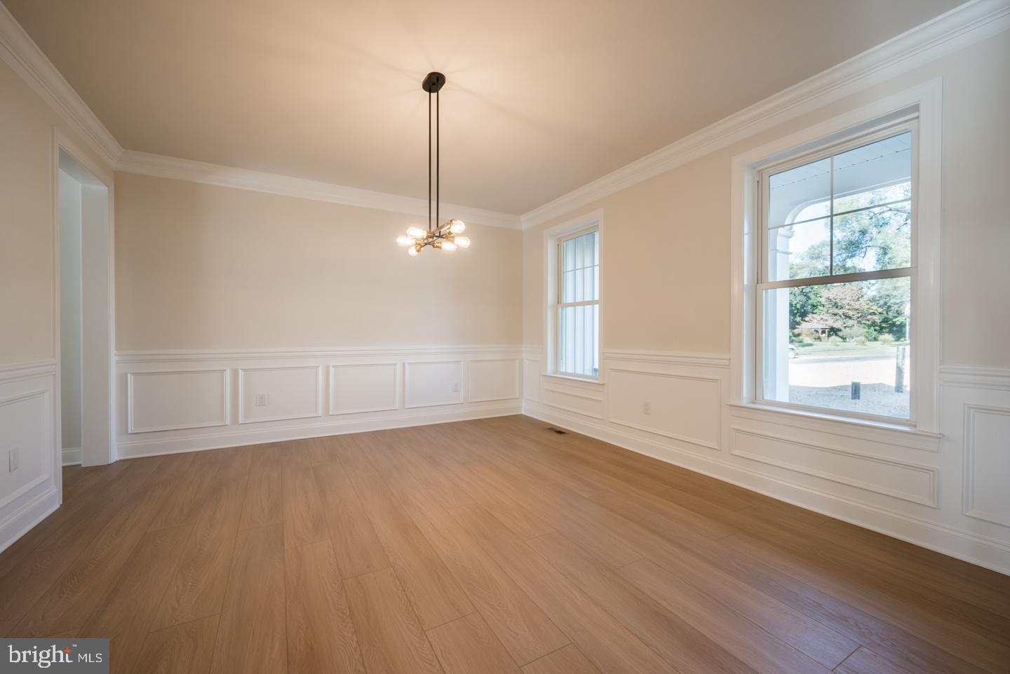 548 Old Forge Road, Unit 1 Media, PA 19063 - Photo 10 of 37 a view of an empty room with wooden floor kitchen view and a window
