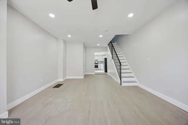 a view of an empty room with stairs