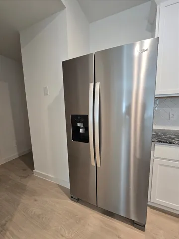 a bathroom with a tub and a shower