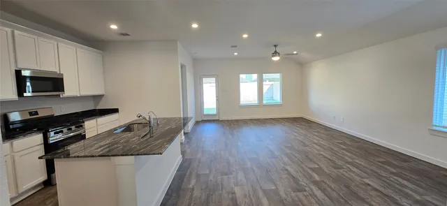 a bathroom with a double vanity sink and mirror