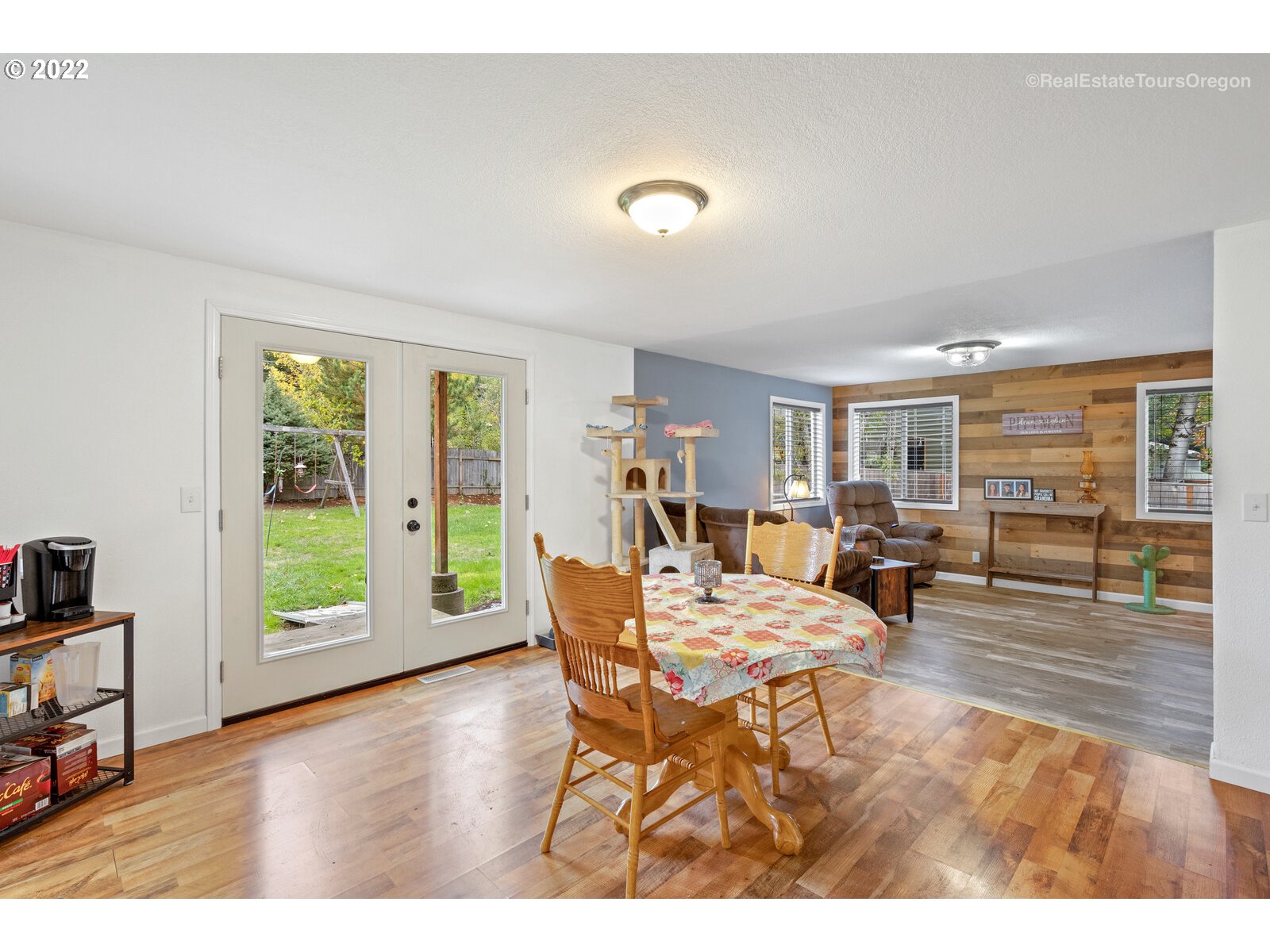 707 Roxe Drive Forest Grove, OR 97116 - Photo 13 of 32 a dining room with furniture and wooden floor