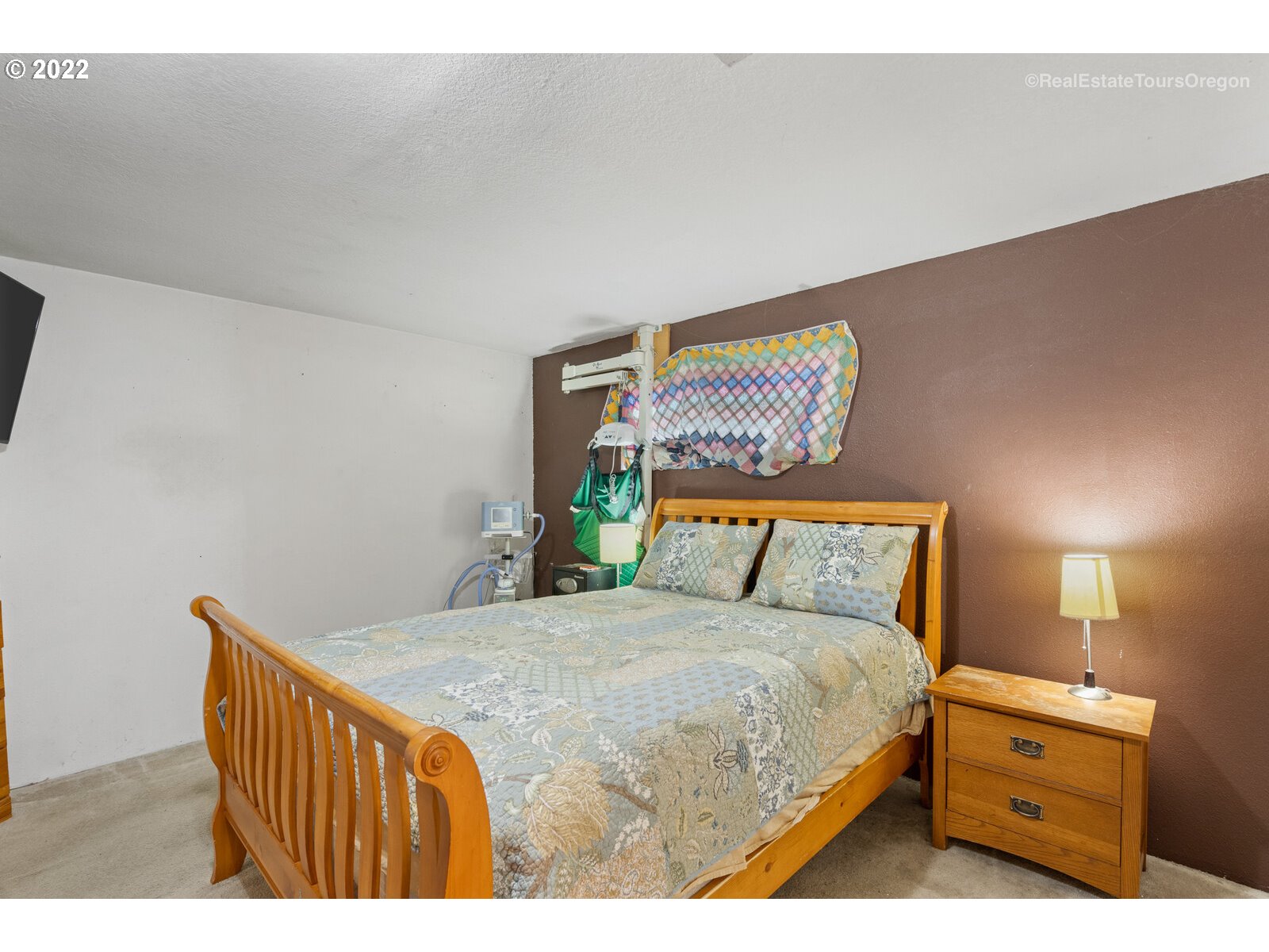 707 Roxe Drive Forest Grove, OR 97116 - Photo 17 of 32 a bedroom with a bed and a lamp