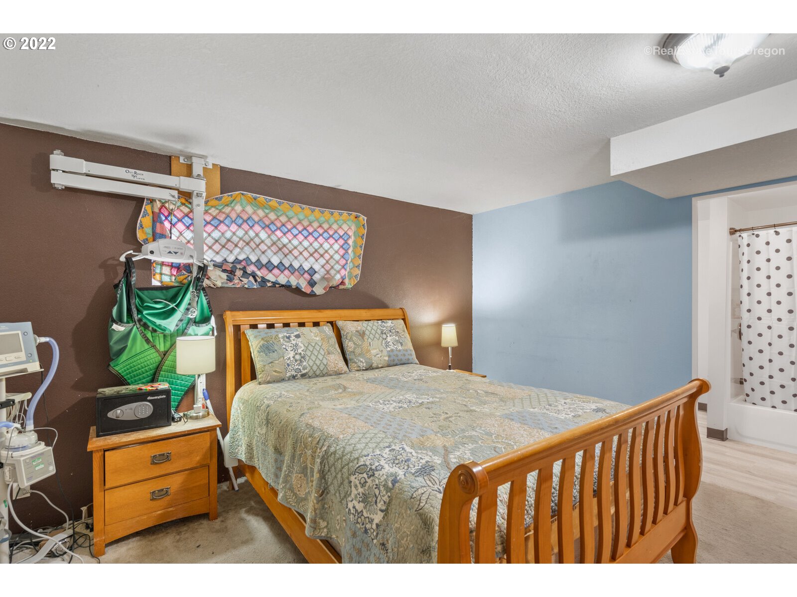 707 Roxe Drive Forest Grove, OR 97116 - Photo 18 of 32 a bedroom with a bed table and a chair