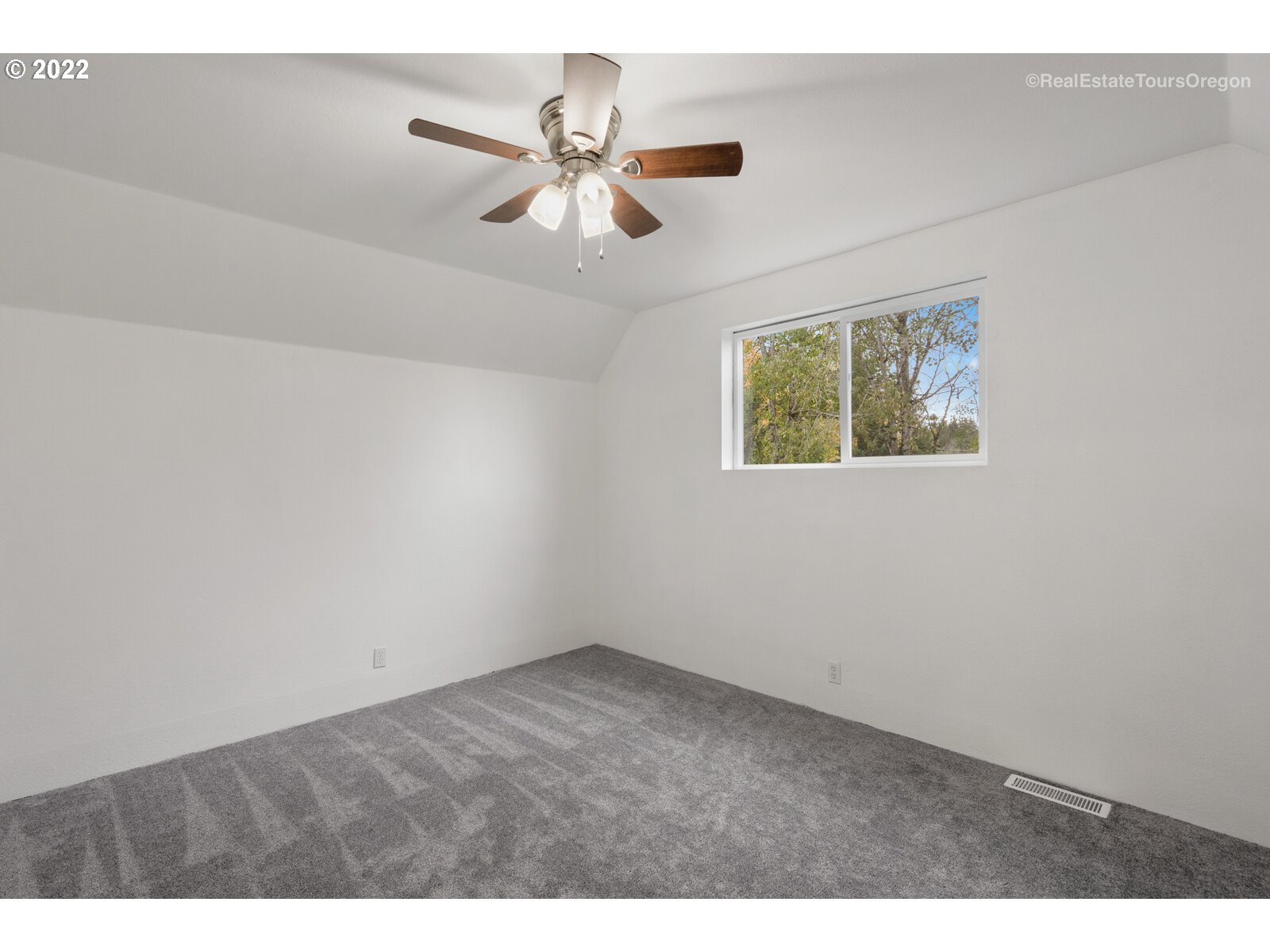 707 Roxe Drive Forest Grove, OR 97116 - Photo 27 of 32 an empty room with windows and fan
