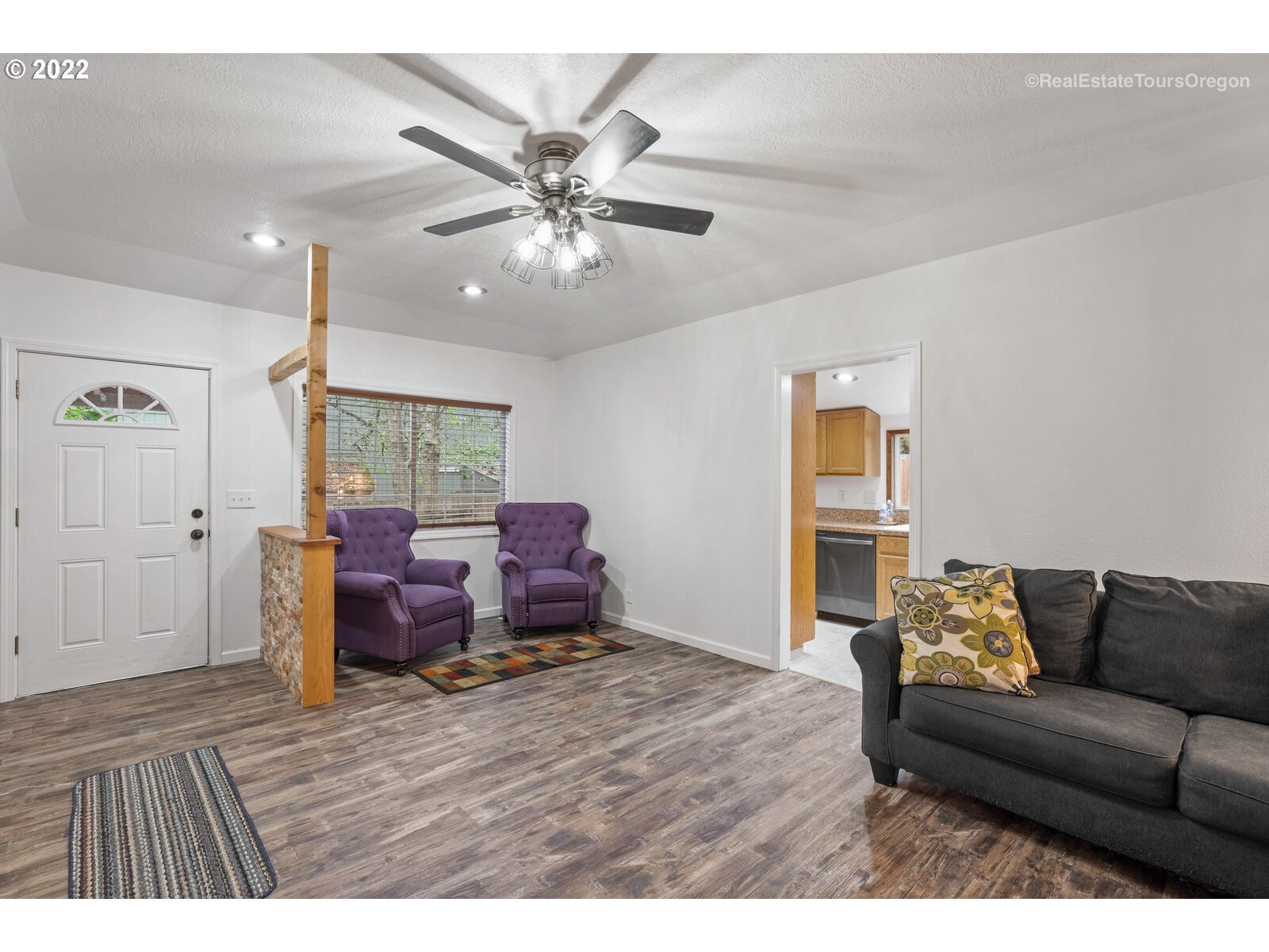 707 Roxe Drive Forest Grove, OR 97116 - Photo 4 of 32 a living room with furniture and a chandelier