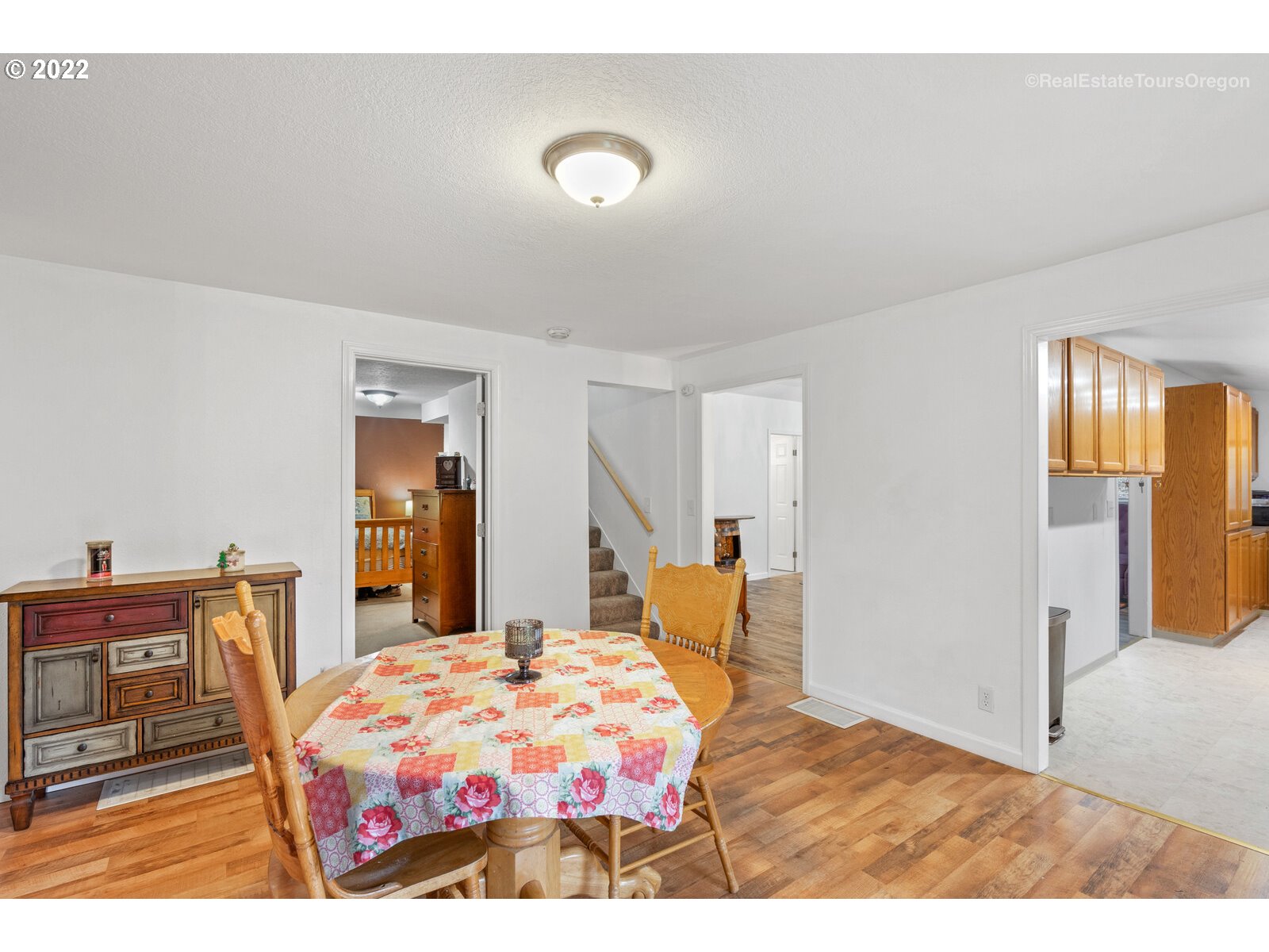707 Roxe Drive Forest Grove, OR 97116 - Photo 9 of 32 a bedroom with a bed and wooden floor