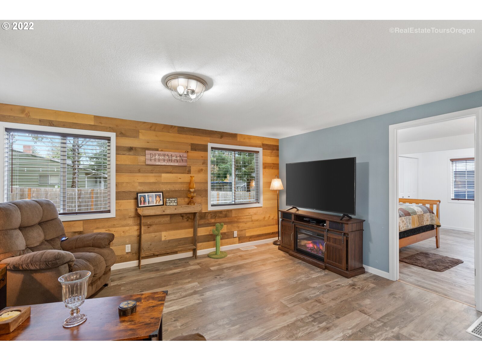 707 Roxe Drive Forest Grove, OR 97116 - Photo 10 of 32 a living room with furniture and a flat screen tv
