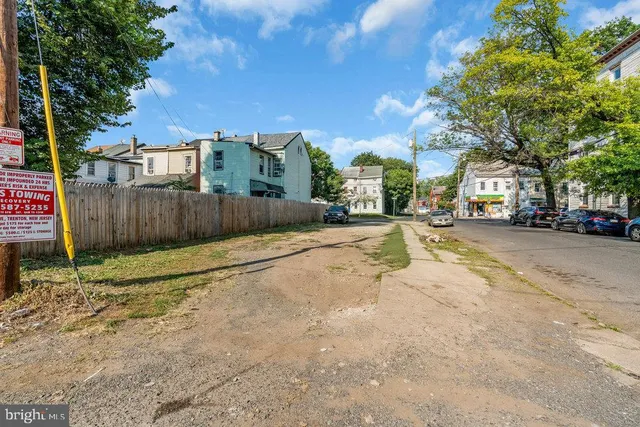 a view of a street with a building in the background