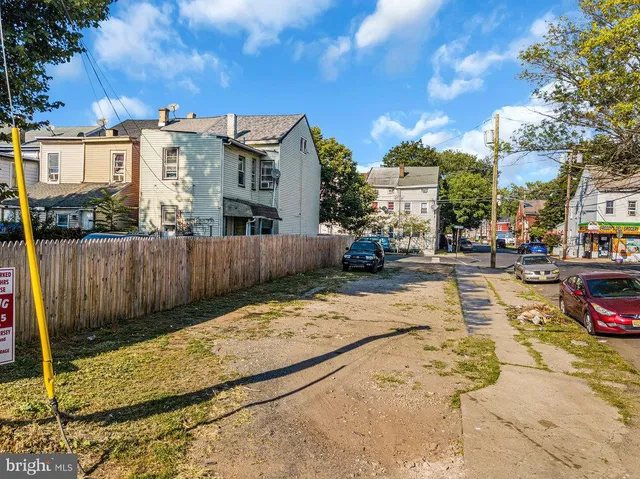 a view of a street with a building in the background