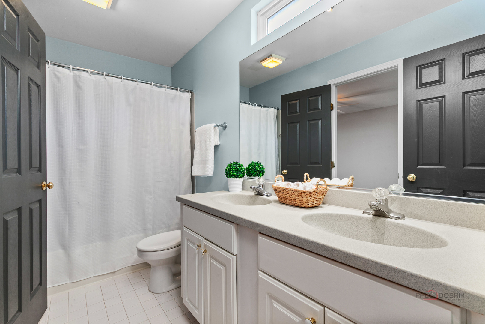 597 Treetop Lane Gurnee, IL 60031 - Photo 19 of 34 a bathroom with a granite countertop sink and a mirror