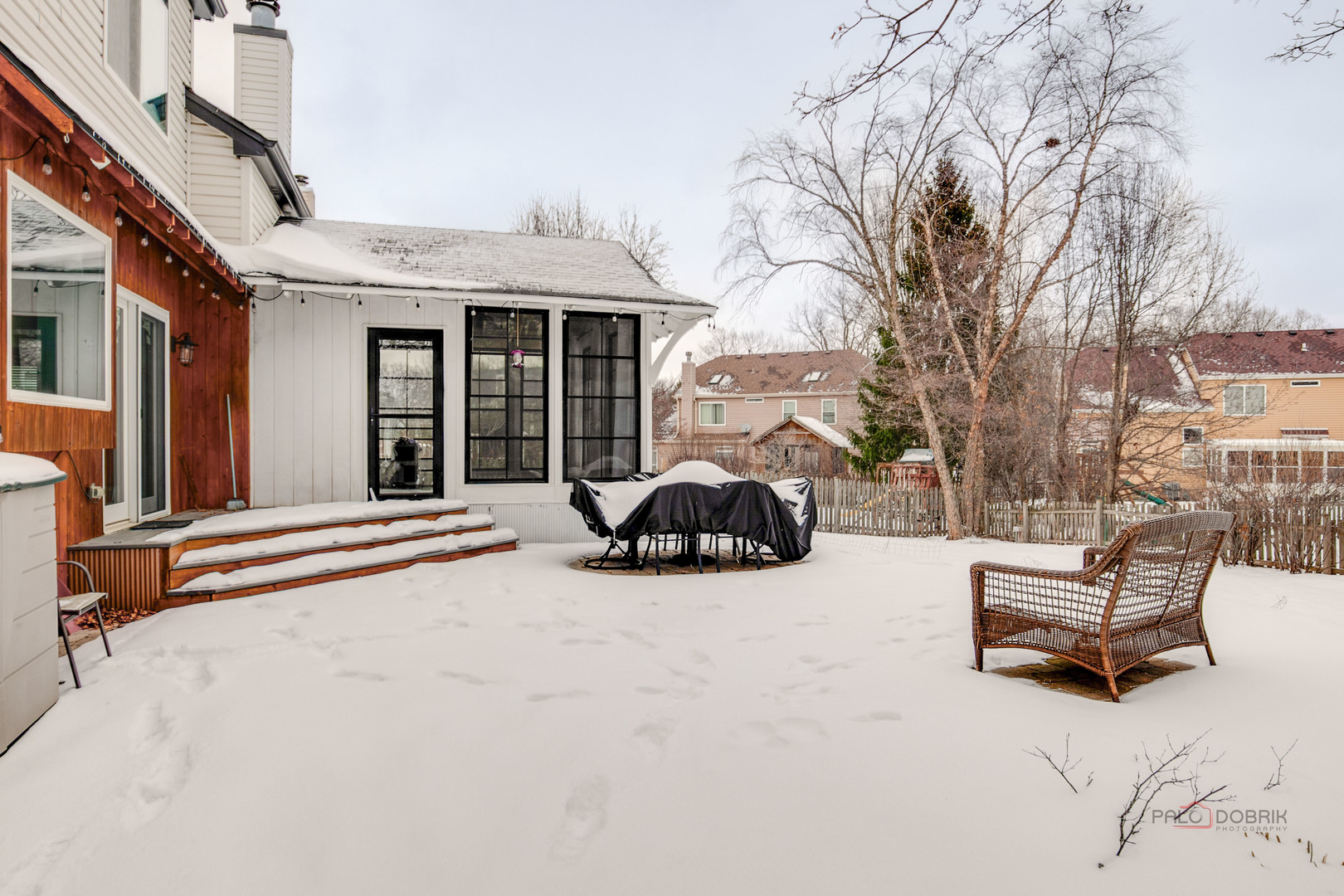 597 Treetop Lane Gurnee, IL 60031 - Photo 32 of 34 a view of a patio with a table and chairs under an umbrella