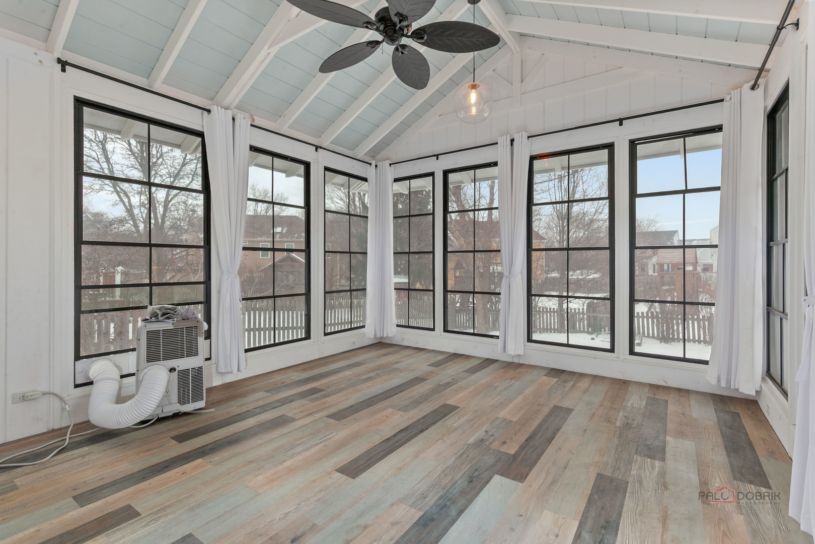 597 Treetop Lane Gurnee, IL 60031 - Photo 10 of 34 a view of an empty room with a window and wooden floor