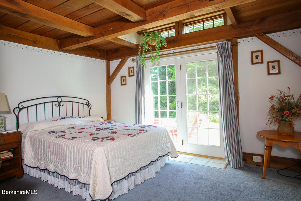544 Tunnel Road Rowe, MA 01367 - Photo 20 of 32 a bedroom with a bed and a window