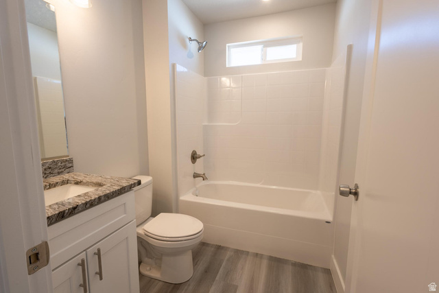 910 East Remington Road Cedar City, UT 84721 - Photo 13 of 29 Bathroom featuring a white vanity with granite-style countertop, undermount sink, and brushed nickel hardware