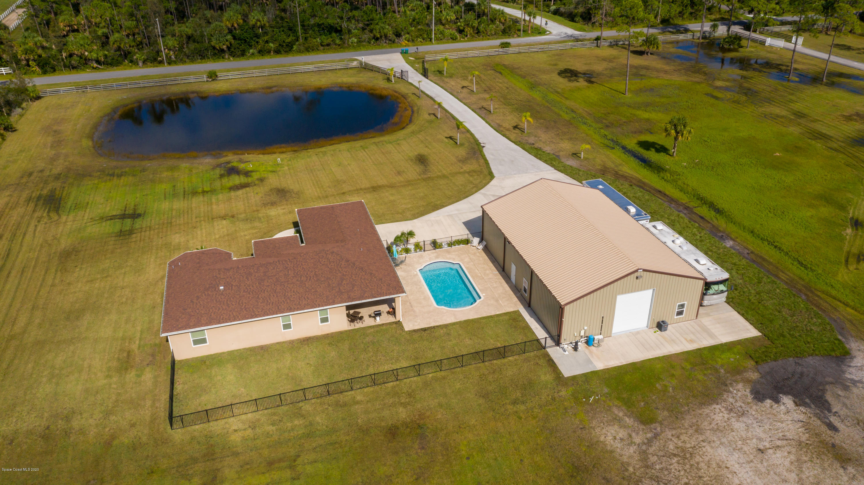 1805 Benjamin Road Grant Valkaria, FL 32950 - Photo 22 of 32 a view of a swimming pool with seating area and furniture