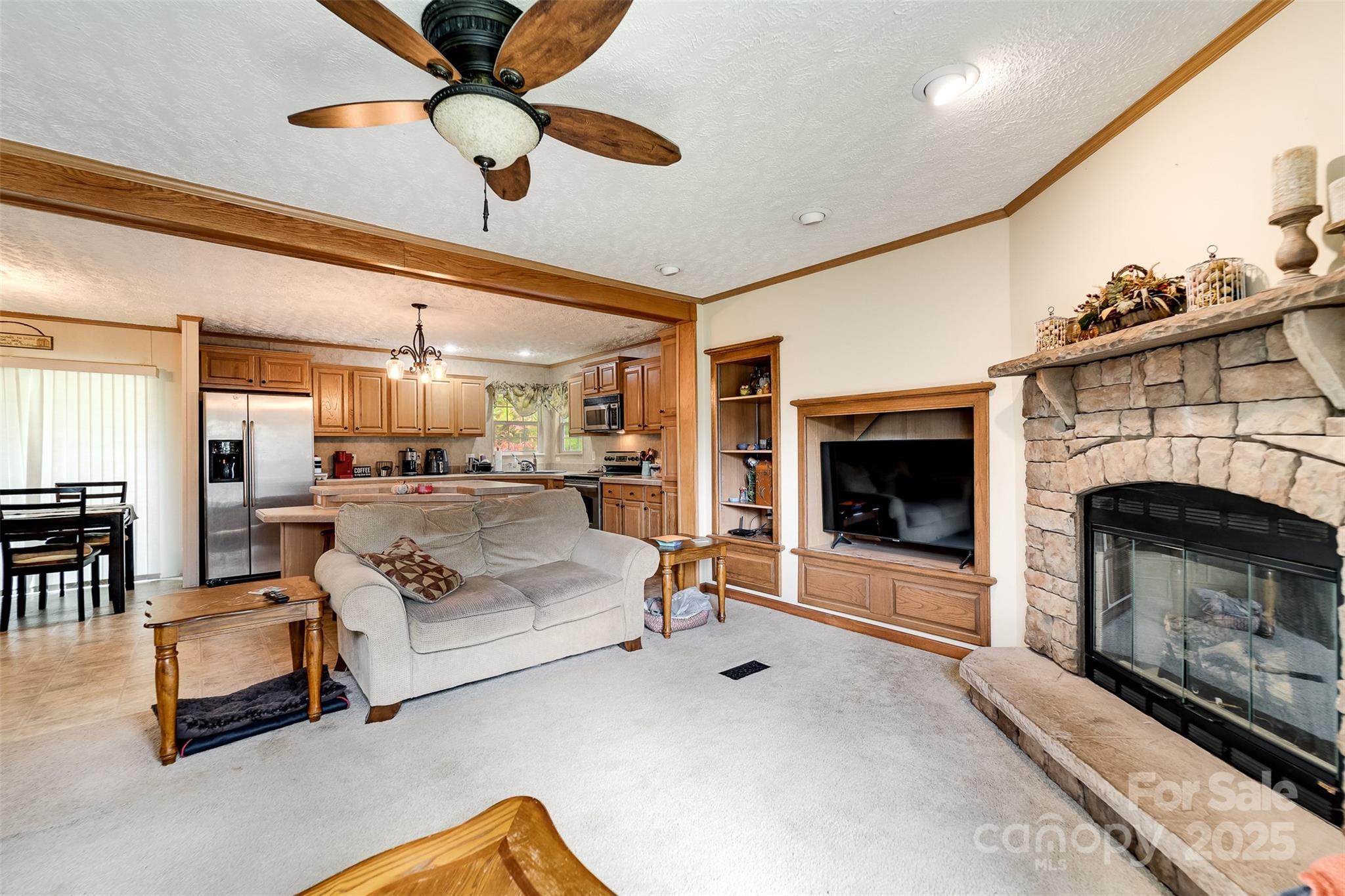 179 Fresh Water Rdg Road Whittier, NC 28789 - Photo 14 of 48 a living room with furniture and a fireplace