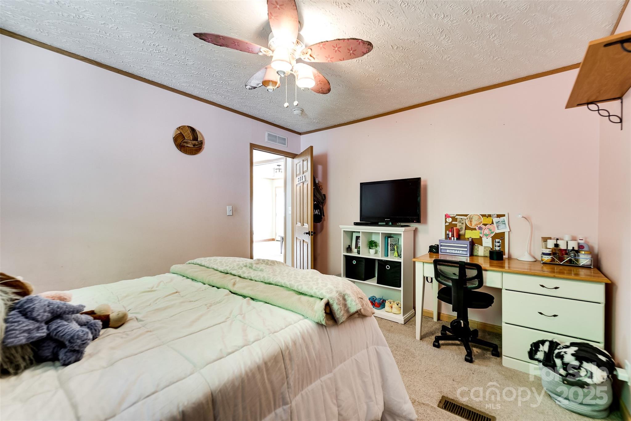 179 Fresh Water Rdg Road Whittier, NC 28789 - Photo 29 of 48 a bedroom with a bed and a flat screen tv