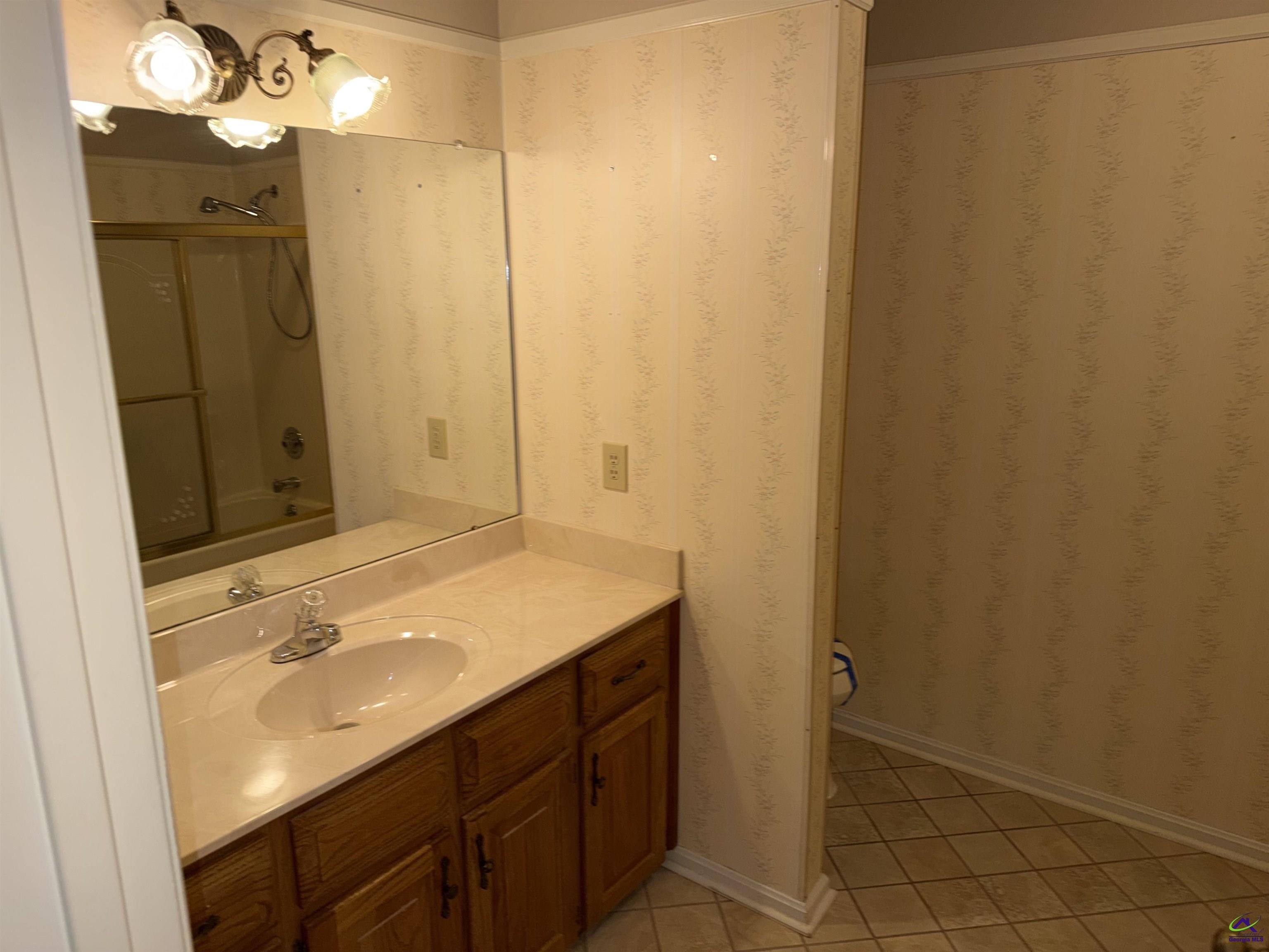 249 Hatcher Road Warner Robins, GA 31088 - Photo 21 of 25 a bathroom with a sink and a mirror