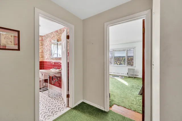 a en suite bathroom with a sink and a mirror