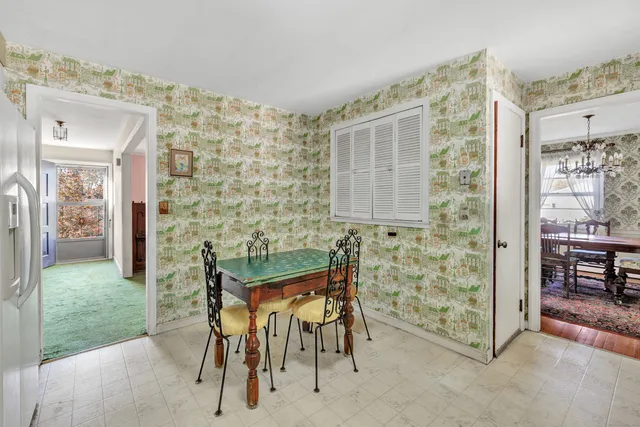 a dining room with furniture and a yard