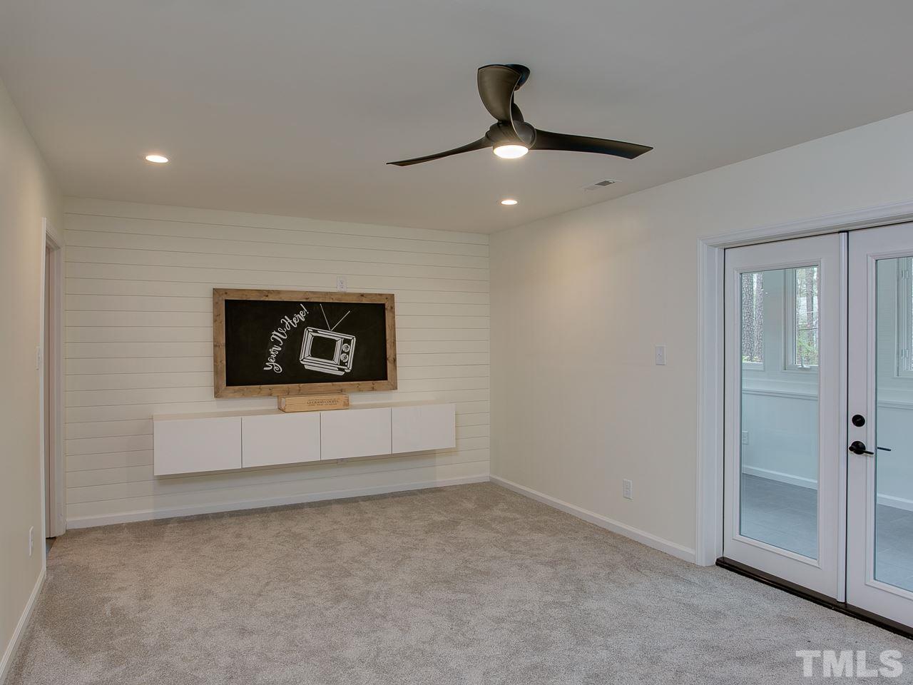 1909 Fountain Ridge Road Chapel Hill, NC 27517 - Photo 11 of 25 an empty room with windows and fan