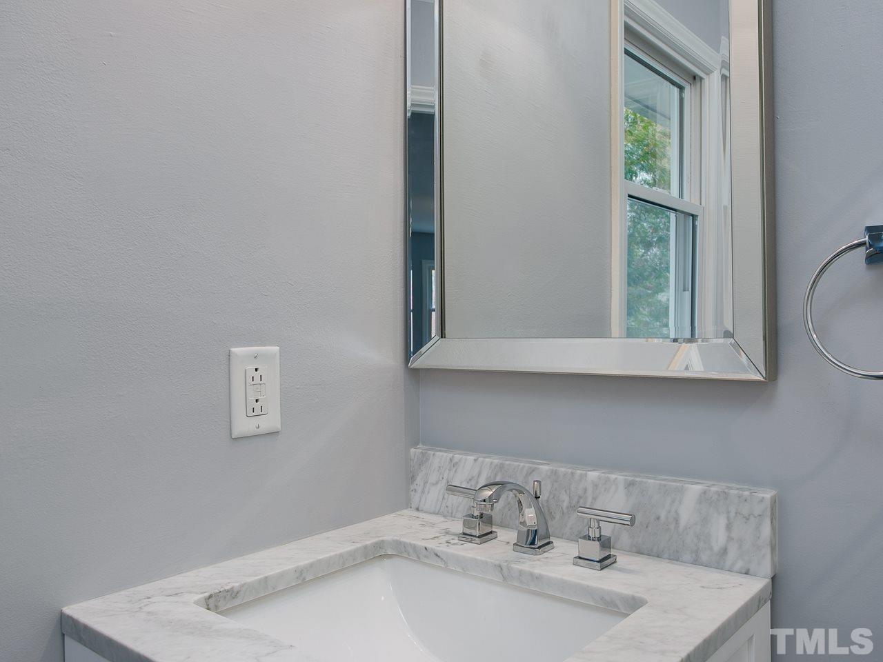1909 Fountain Ridge Road Chapel Hill, NC 27517 - Photo 13 of 25 a bathroom with a sink and a mirror
