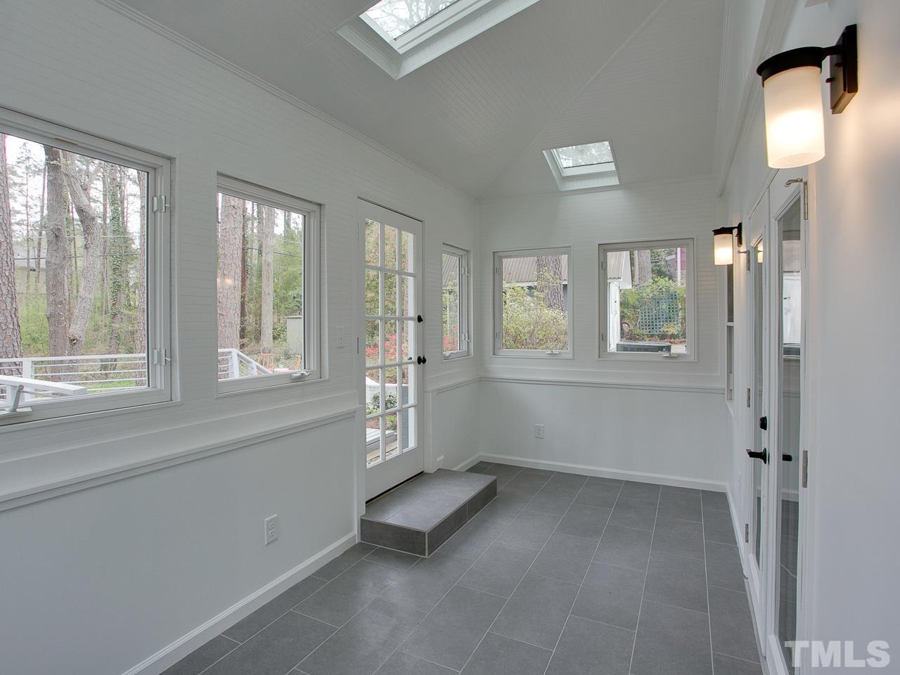 1909 Fountain Ridge Road Chapel Hill, NC 27517 - Photo 17 of 25 a view of an empty room with a window and a bathroom