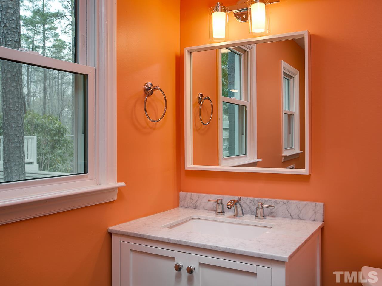 1909 Fountain Ridge Road Chapel Hill, NC 27517 - Photo 18 of 25 a bathroom with a sink and a mirror