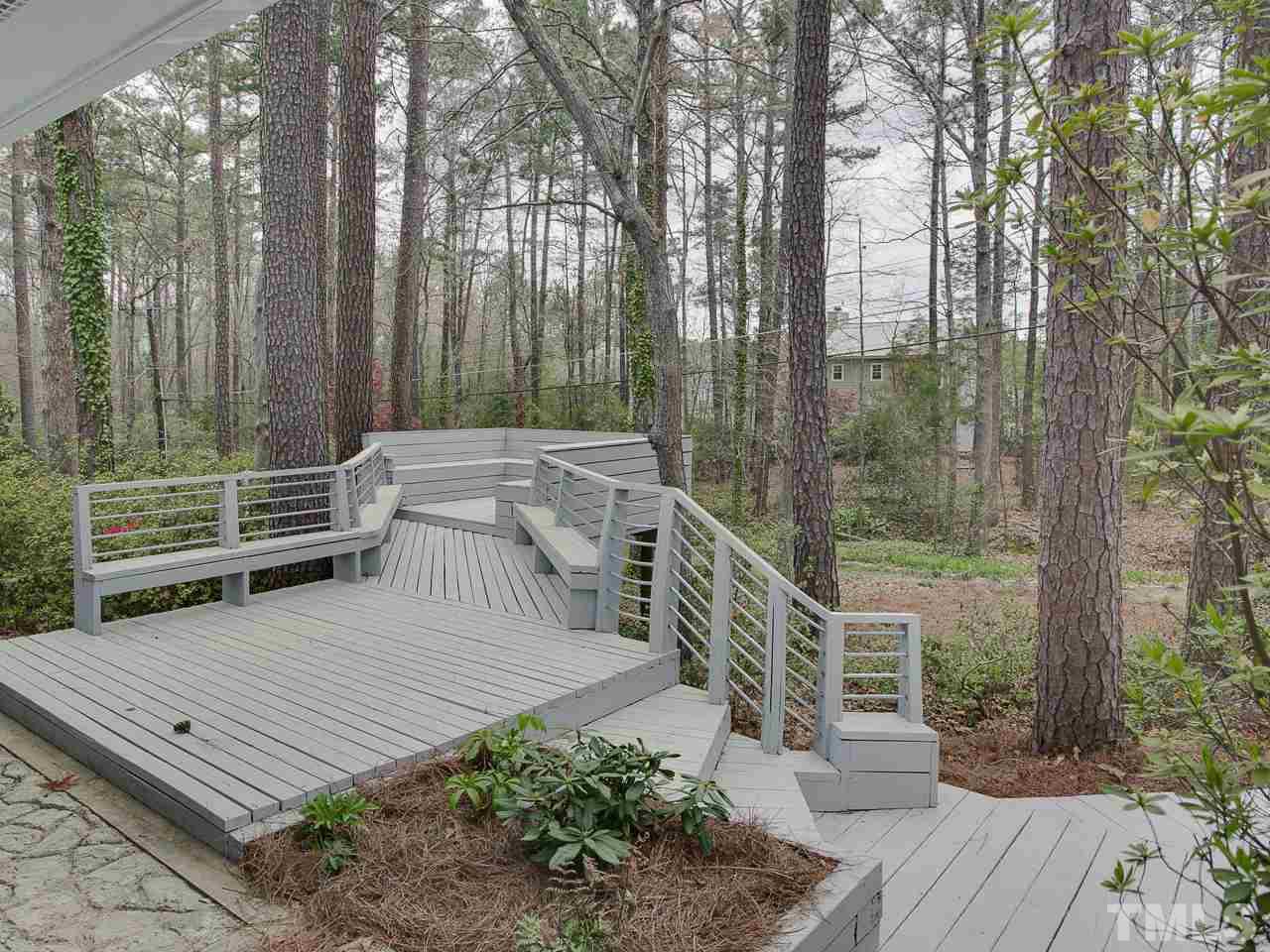 1909 Fountain Ridge Road Chapel Hill, NC 27517 - Photo 21 of 25 a view of a patio with a table and chairs