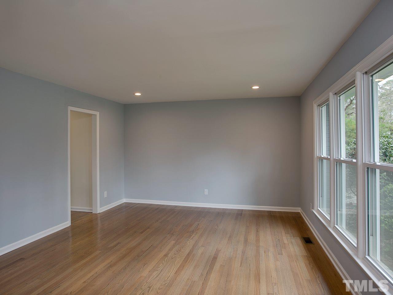 1909 Fountain Ridge Road Chapel Hill, NC 27517 - Photo 5 of 25 a view of room with window and wooden floor