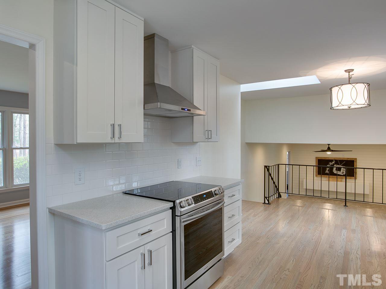 1909 Fountain Ridge Road Chapel Hill, NC 27517 - Photo 8 of 25 a kitchen with a stove a sink and a refrigerator