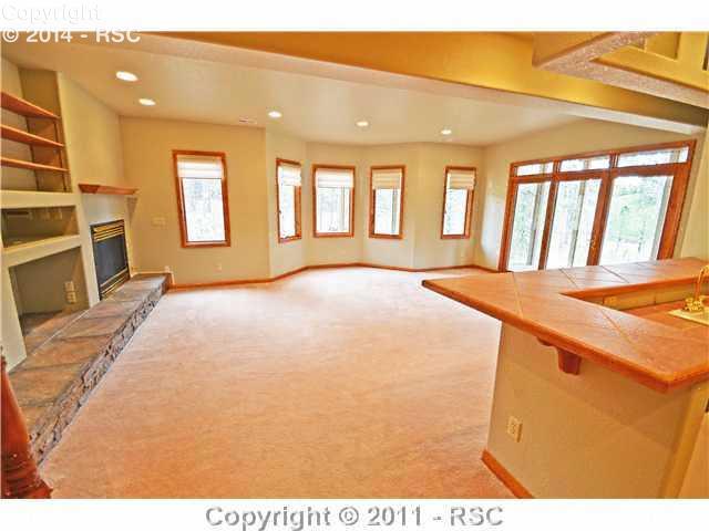7270 Shoup Road Colorado Springs, CO 80908 - Photo 13 of 16 Family room has a walkout to a south facing covered patio and yard.