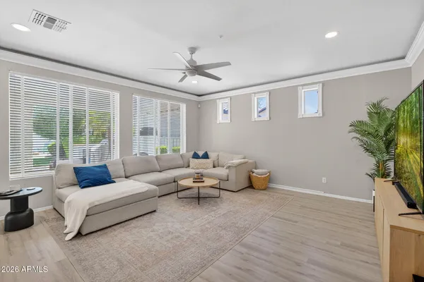 a living room with furniture and a large window