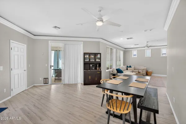a large kitchen with a table and chairs