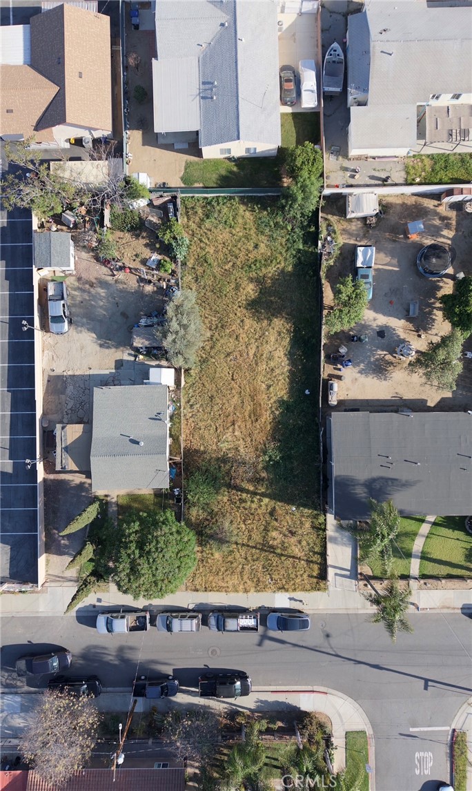 7542 Peters Street Riverside, CA 92504 - Photo 2 of 13 an aerial view of a house with a yard and large trees