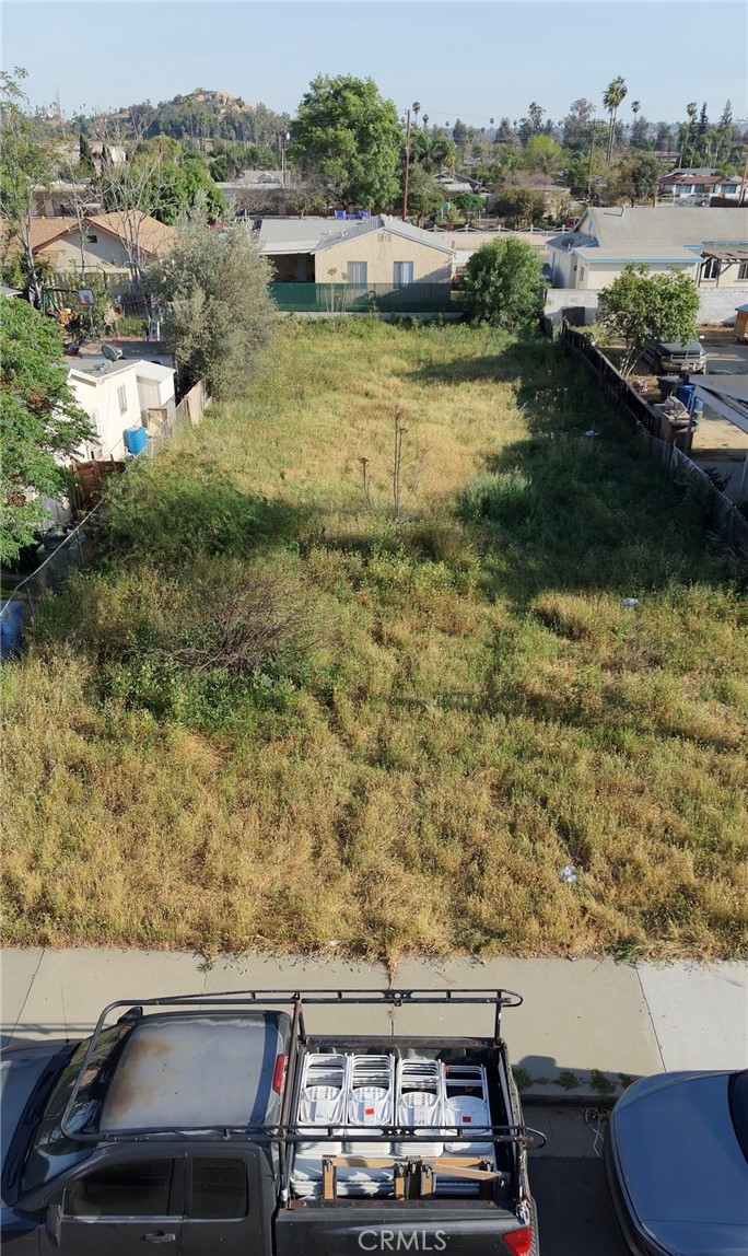 7542 Peters Street Riverside, CA 92504 - Photo 7 of 13 an aerial view of residential houses with outdoor space