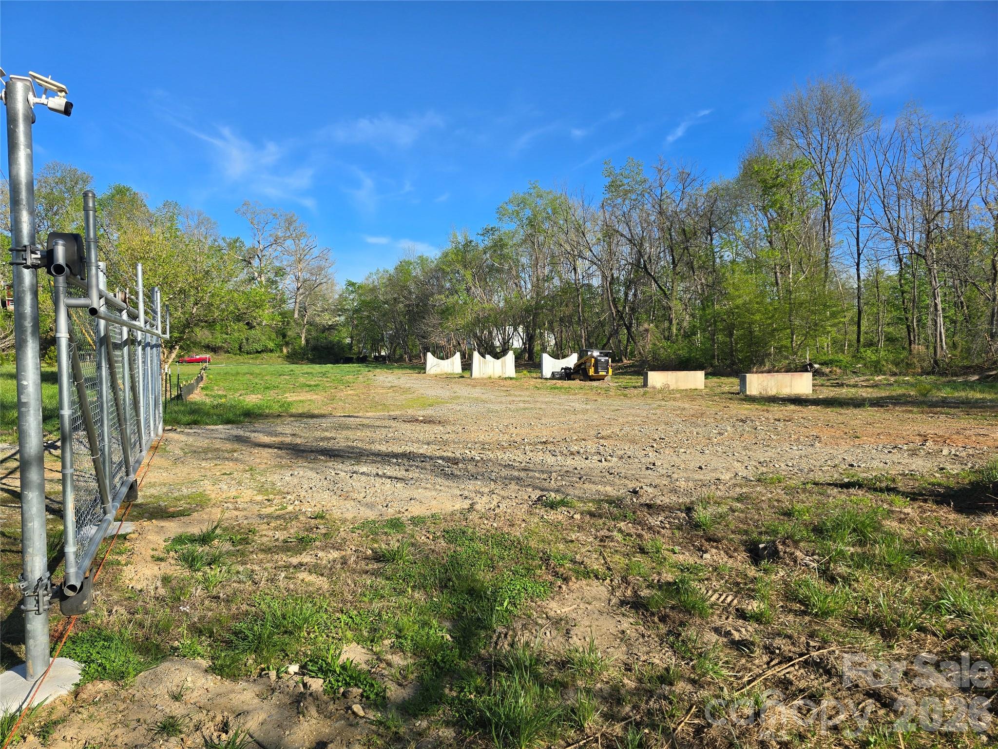 a view of outdoor space with trees all around