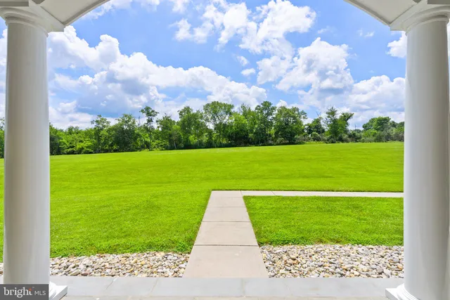 a living room with furniture a fireplace and a table