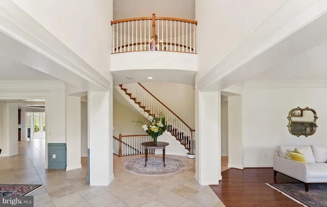a dining room with furniture a rug and wooden floor