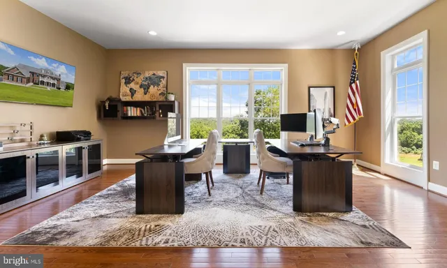 a bedroom with a bed a window and potted plant