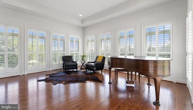 a spacious bedroom with a bed and a couch