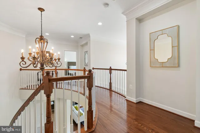 a spacious bathroom with a tub sink and mirror