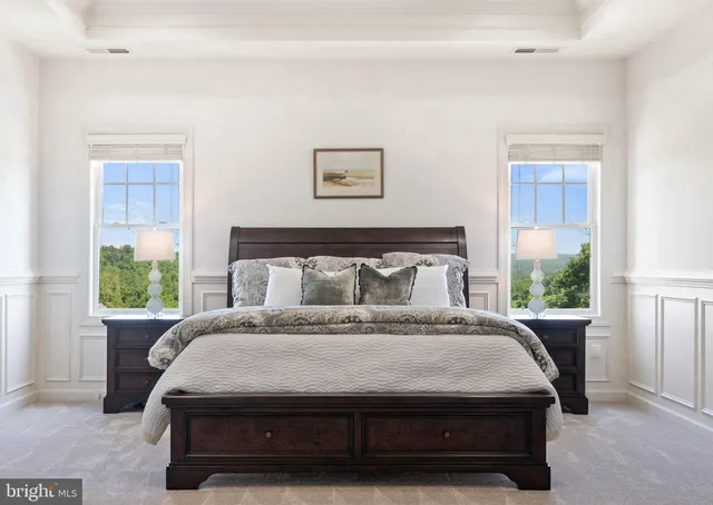 a bath tub sitting in a bathroom next to a window