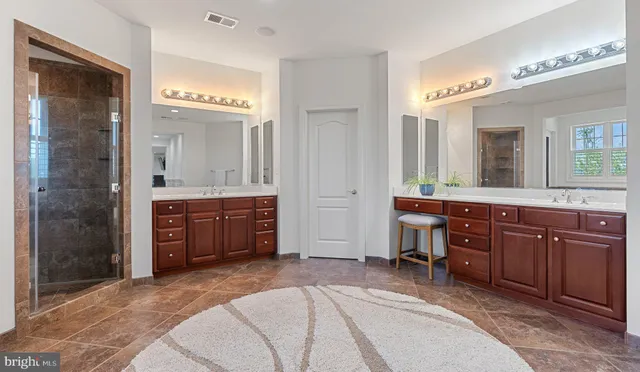 a spacious bedroom with a bed and a couch