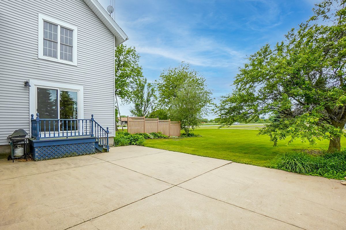 10057 Cherry Valley Road Genoa, IL 60135 - Photo 27 of 32 a view of a house with backyard and garden