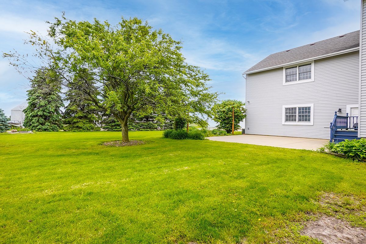 10057 Cherry Valley Road Genoa, IL 60135 - Photo 28 of 32 a view of a house with a yard
